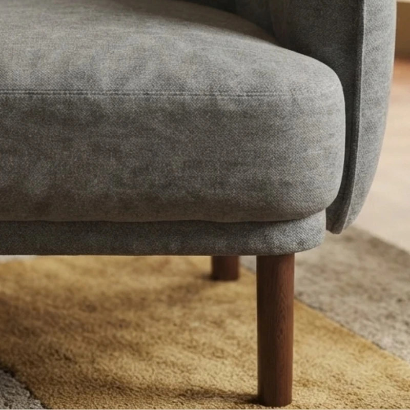 Fauteuil en tissu gris capitonné pieds hévéa WINDSOR Sofacasa